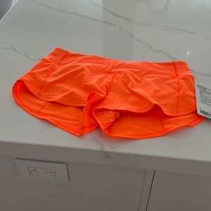 Brand new with tags and never worn Neon orange speed up shirts 2.5 length- l